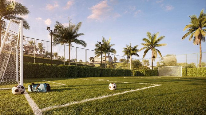 Campo de futebol society com grama sintética e traves